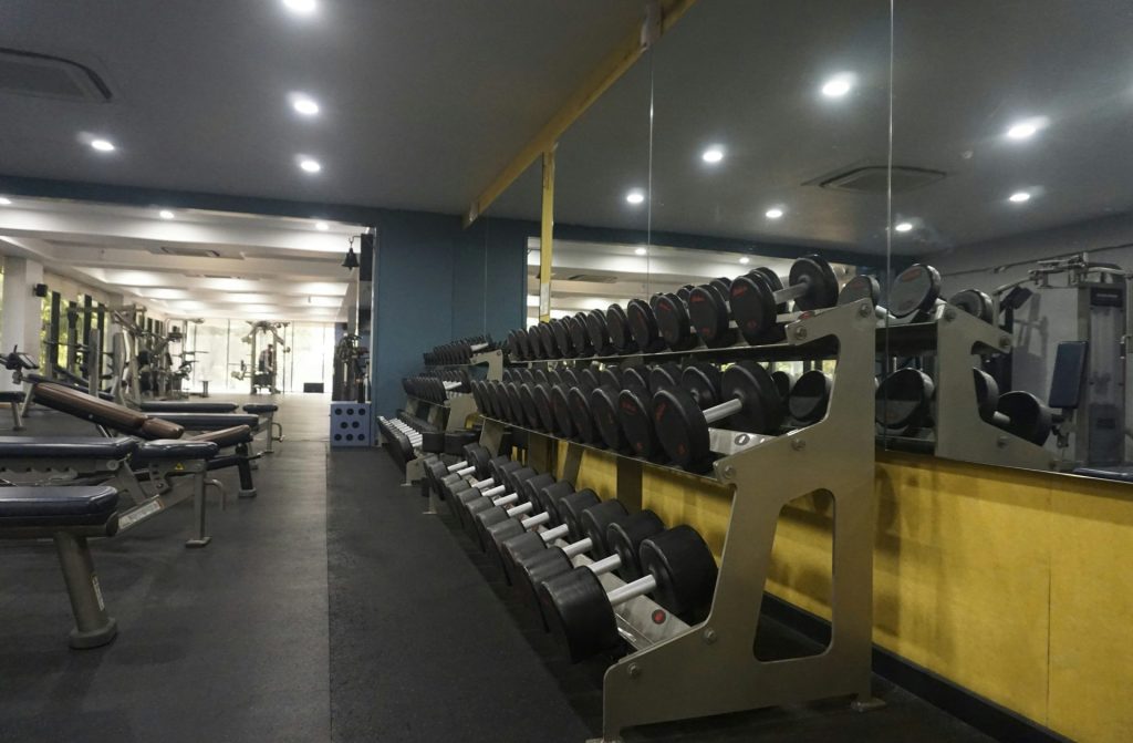 Dumbbell rack in a well-lit gym